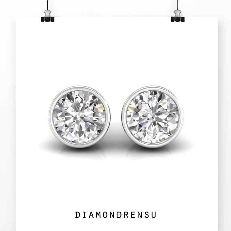Lab grown diamond stud earrings with round stones in rose gold bezel.
