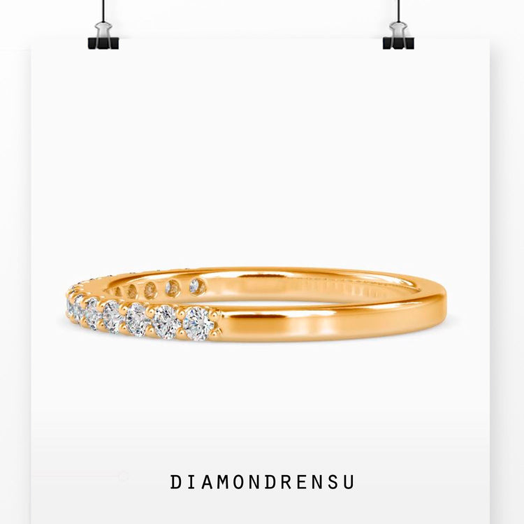Simple diamond wedding band crafted in white gold.
