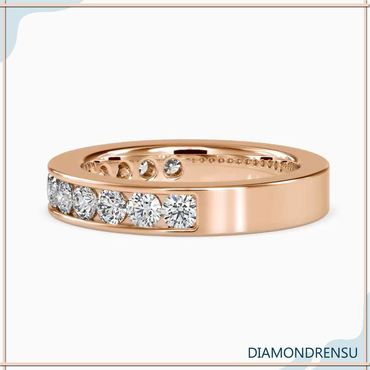 Semi eternity wedding band in classic channel design.
