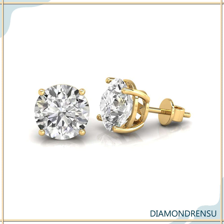 Round diamond stud earrings with screw back design.
