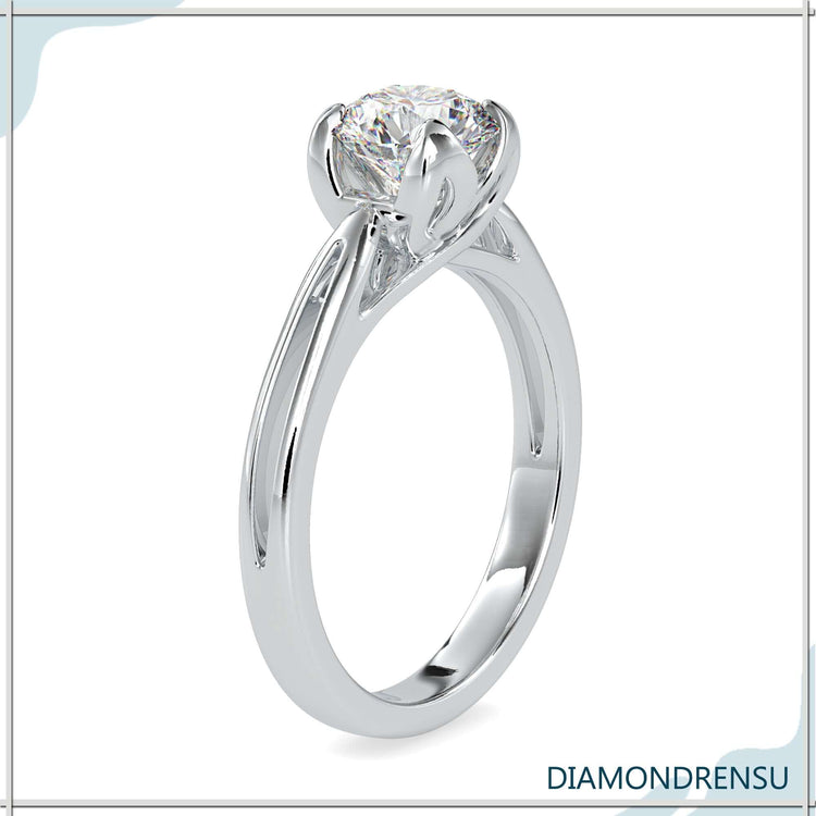 Elegant yellow gold engagement ring with tulip petal detailing.
