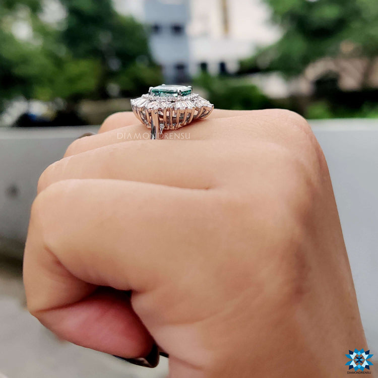 Diamondrensu UK blue moissanite halo engagement ring.
