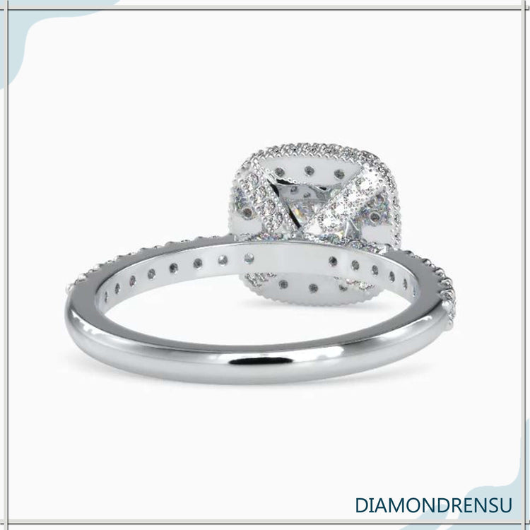 Lab grown diamond engagement ring with halo and side accents.
