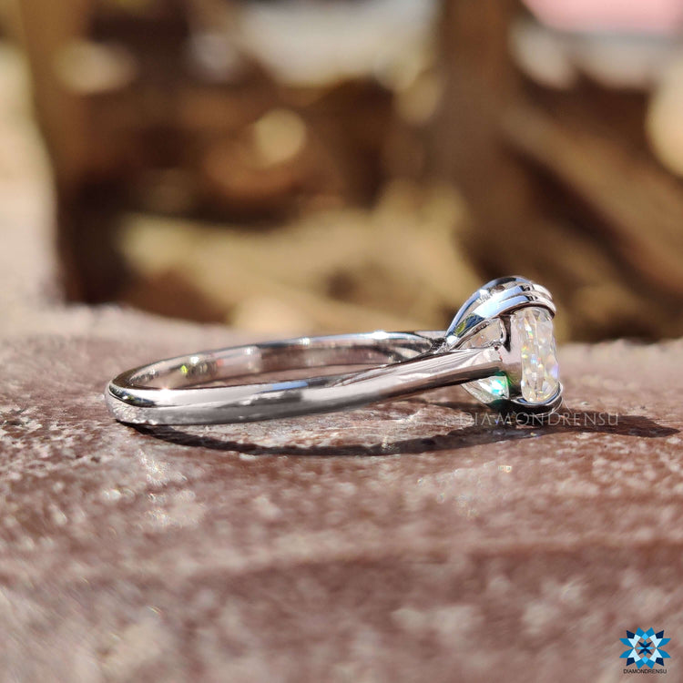 Moissanite ring featuring cushion Rensu cut in a double prong setting.
