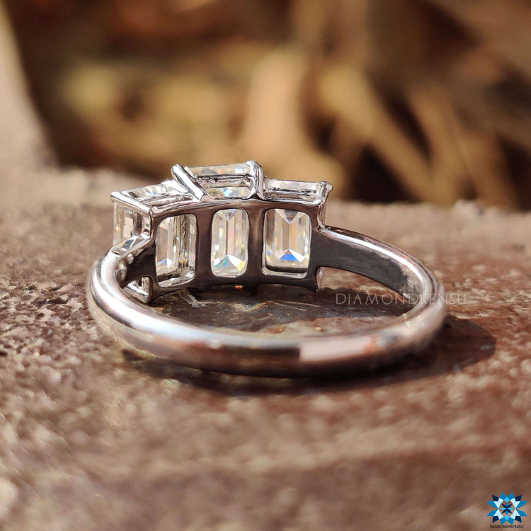 Handmade emerald moissanite ring in white gold.
