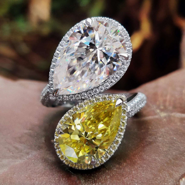 Two stone engagement ring with pear cut moissanites in toi et moi style.
