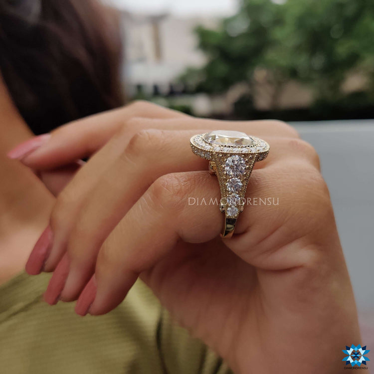 Custom engagement ring featuring cushion Rensu cut moissanite.
