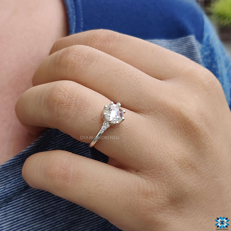 Muse ring design with round rose cut Moissanite in handmade white gold band.
