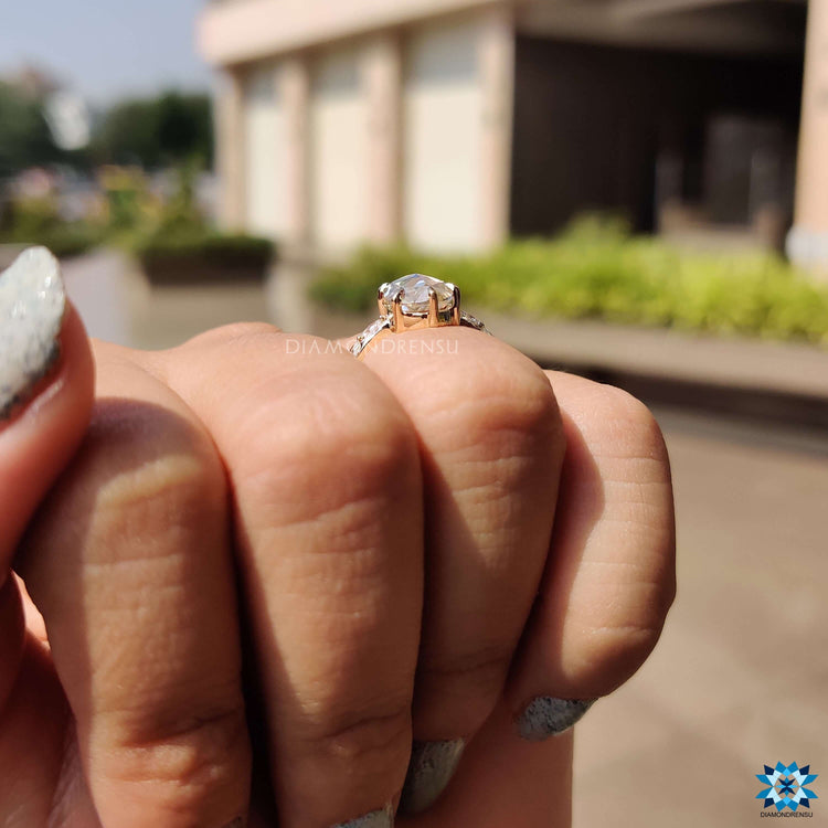 Oval rose cut center stone ring with delicate side stones.
