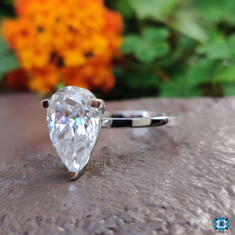 Custom solitaire moissanite ring in a sleek prong design.
