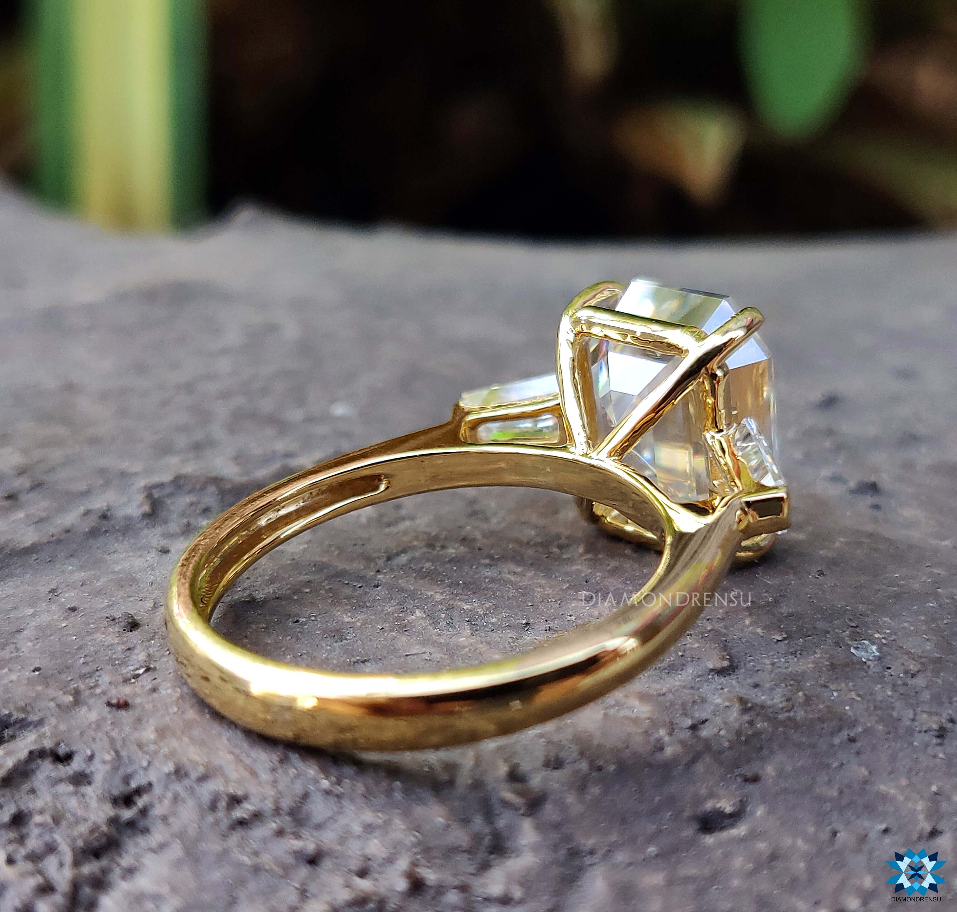 Tapered Baguette Ring design featuring an emerald cut tapered baguette ring.