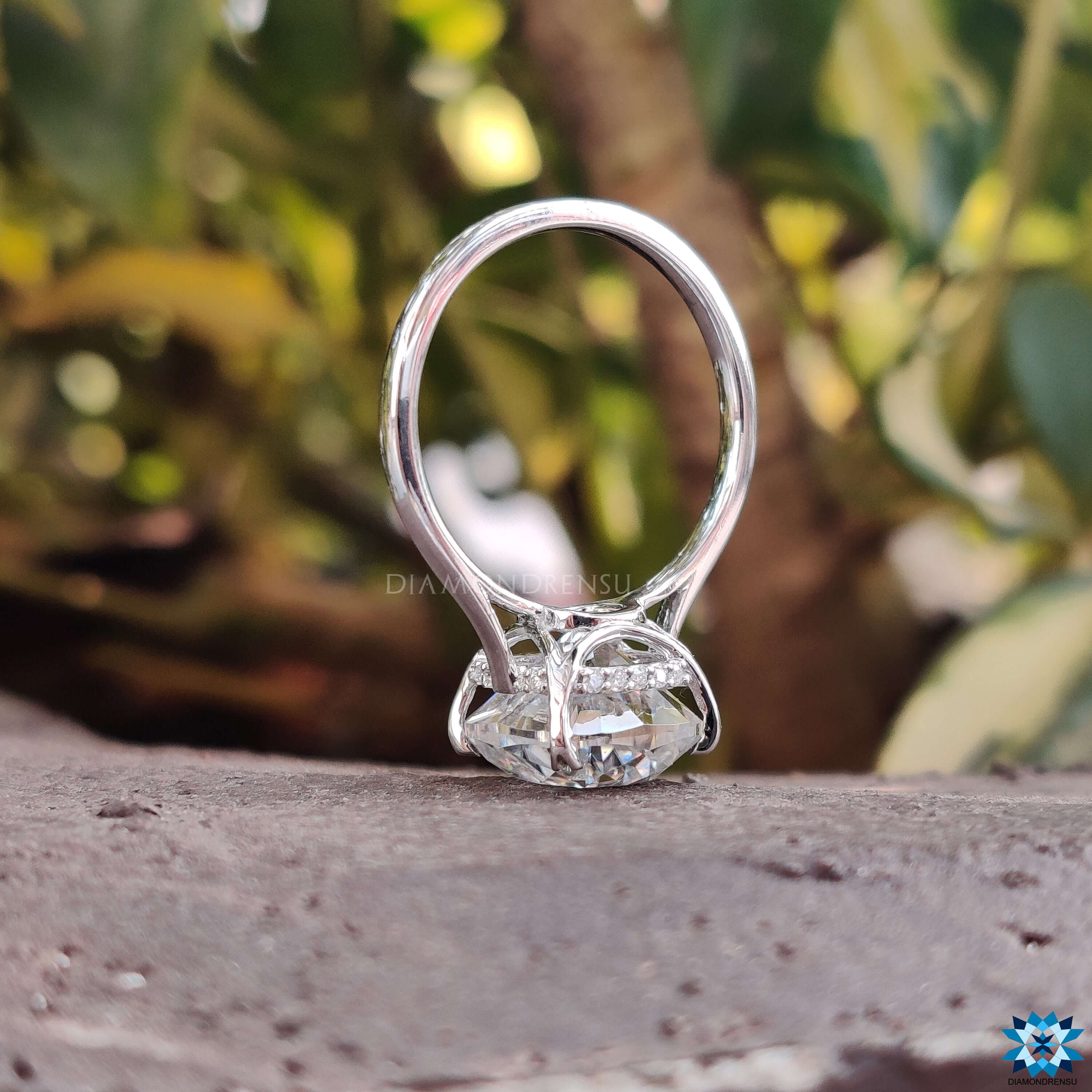 Buy engagement ring featuring a gorgeous cushion cut moissanite ring with a unique design.