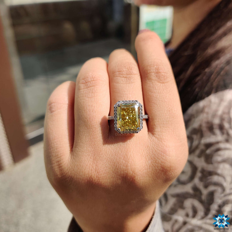 Yellow canary moissanite engagement ring with halo setting.
