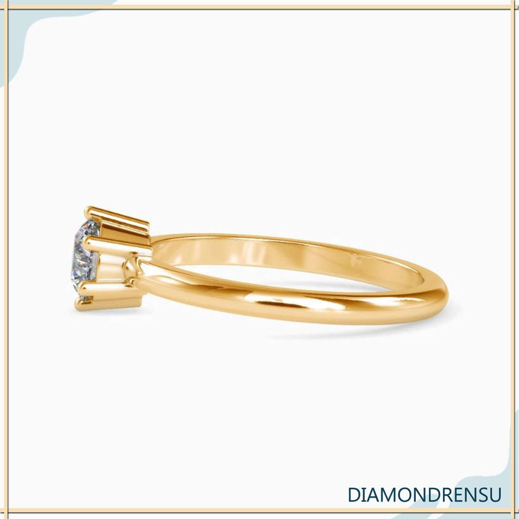 Yellow gold ring with round solitaire in six prong configuration.
