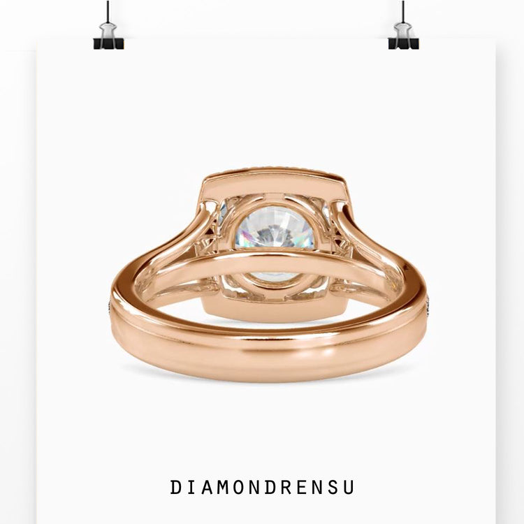 Yellow gold ring with round prong setting and diamond halo.
