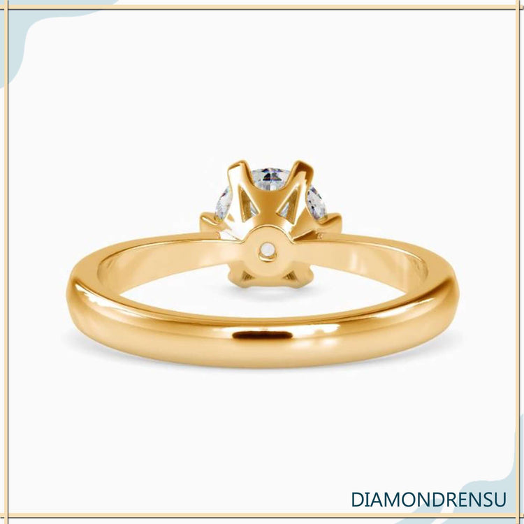 Lab grown diamond engagement ring with tapered shank design.
