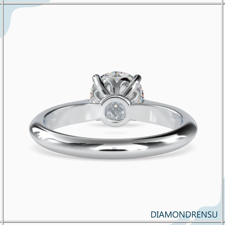 Yellow gold engagement ring with handmade knife edge design.
