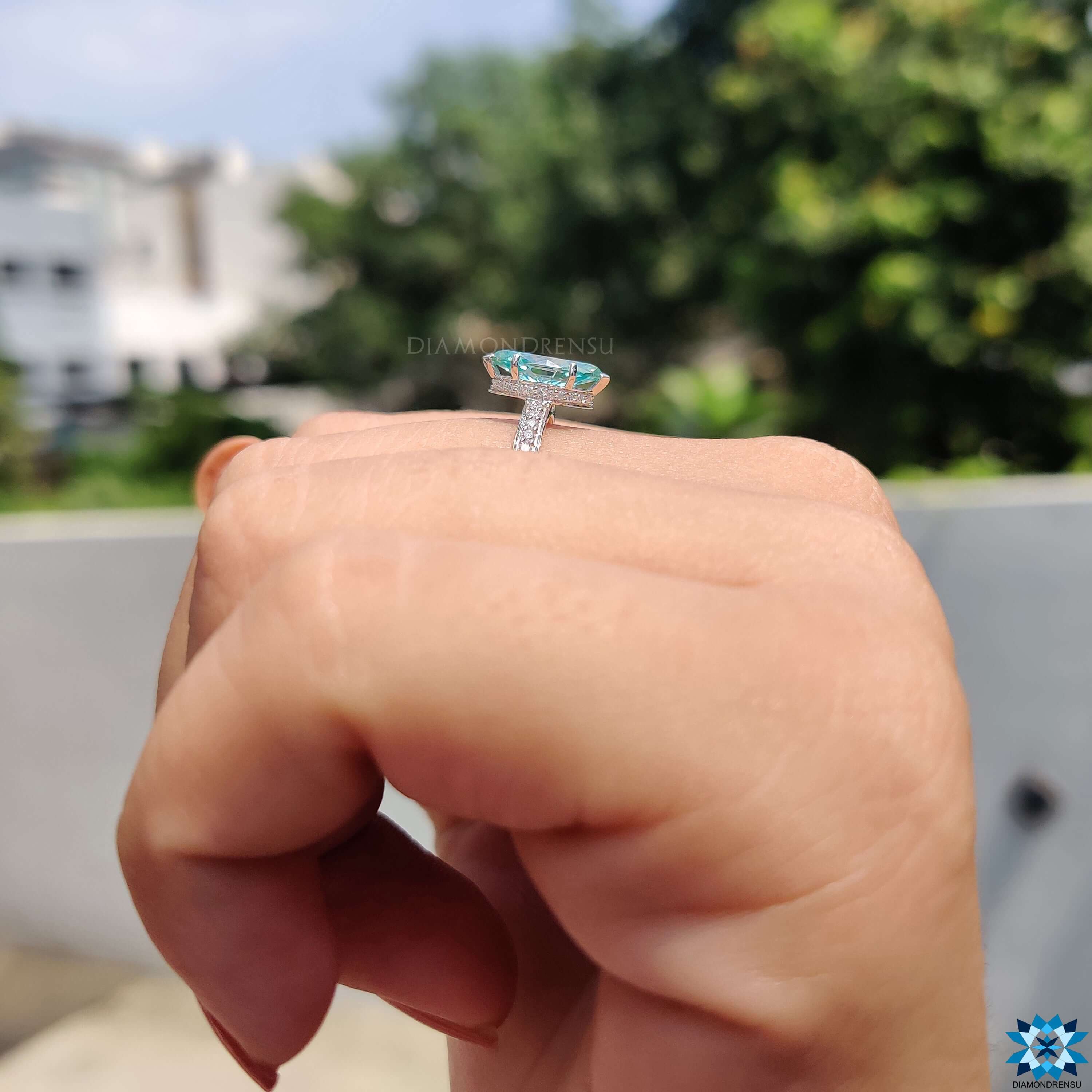 V shaped prongs securing a beautiful marquise moissanite stone in a ring.