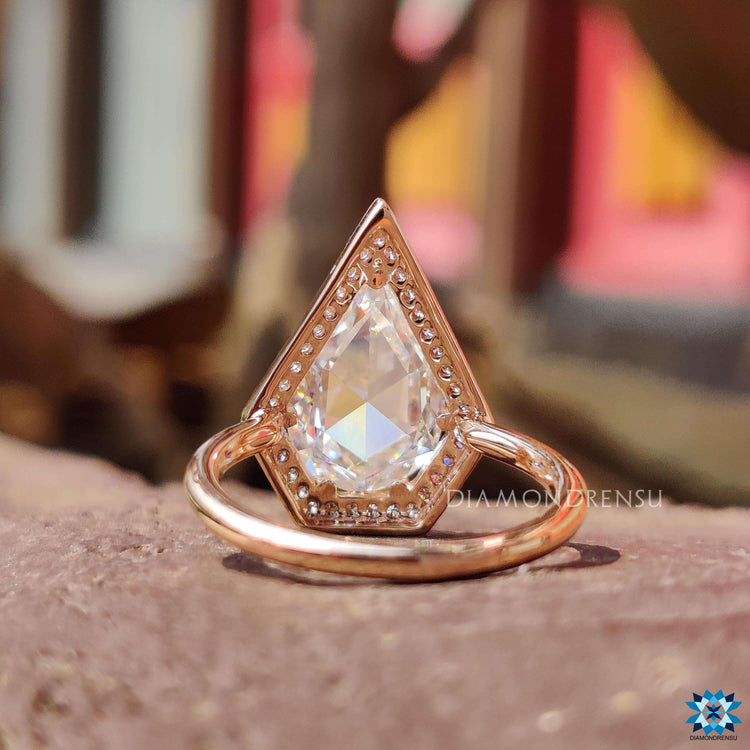 Moissanite halo ring in prong setting.
