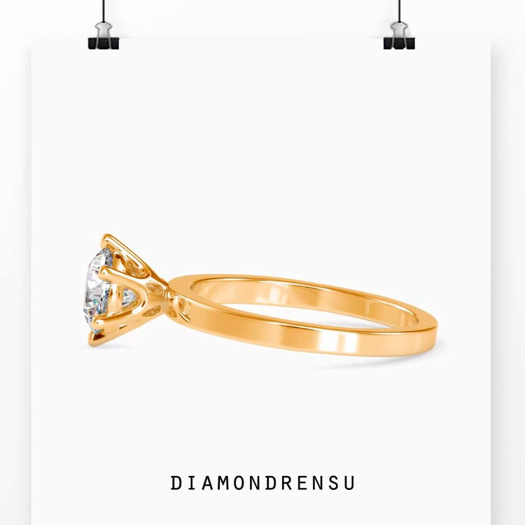 Solitaire setting in yellow gold with lab grown diamond.
