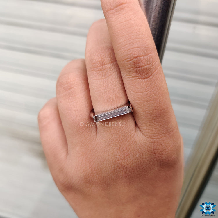 Solitaire setting ring with baguette cut moissanite.
