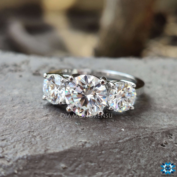 Custom three stone engagement ring in white gold.
