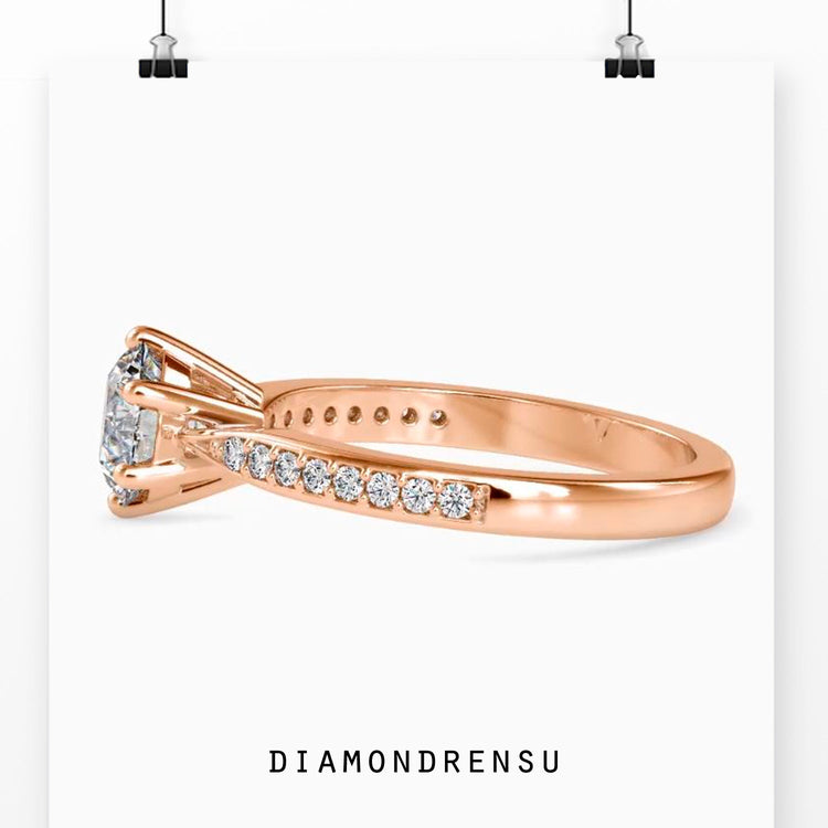 Yellow gold diamond ring with tapered shank and lab stones.
