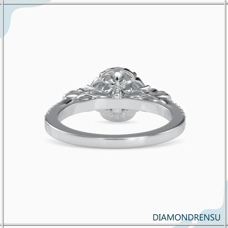 Lab grown diamond set in floral halo rose gold ring.
