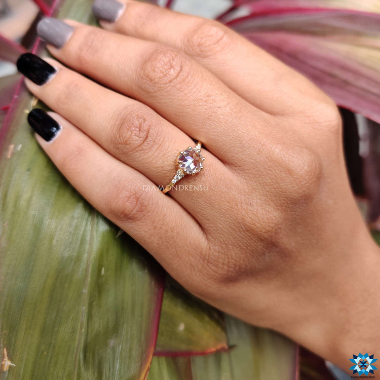 Handmade ring with a rose cut moissanite in prong setting design.
