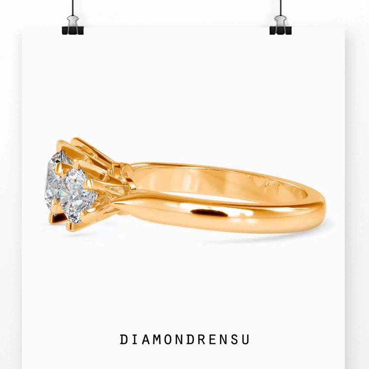 Lab grown diamond engagement ring in tab prong 3 stone design.

