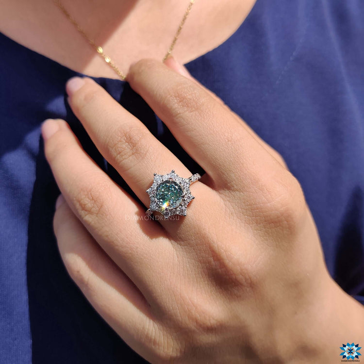 Handmade moissanite ring featuring pave set details.
