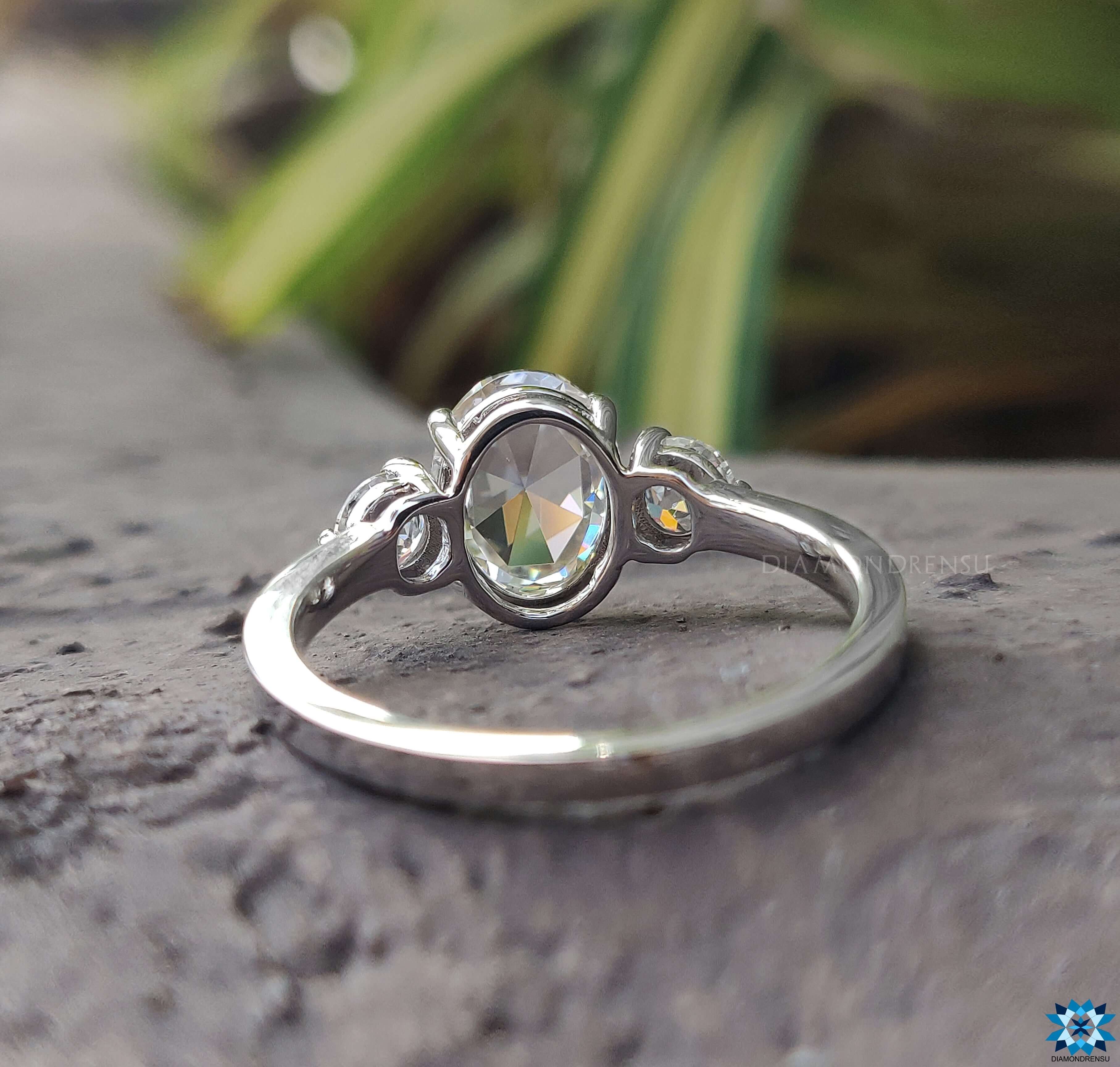 White gold ring with an oval shaped engagement ring for a classic touch.
