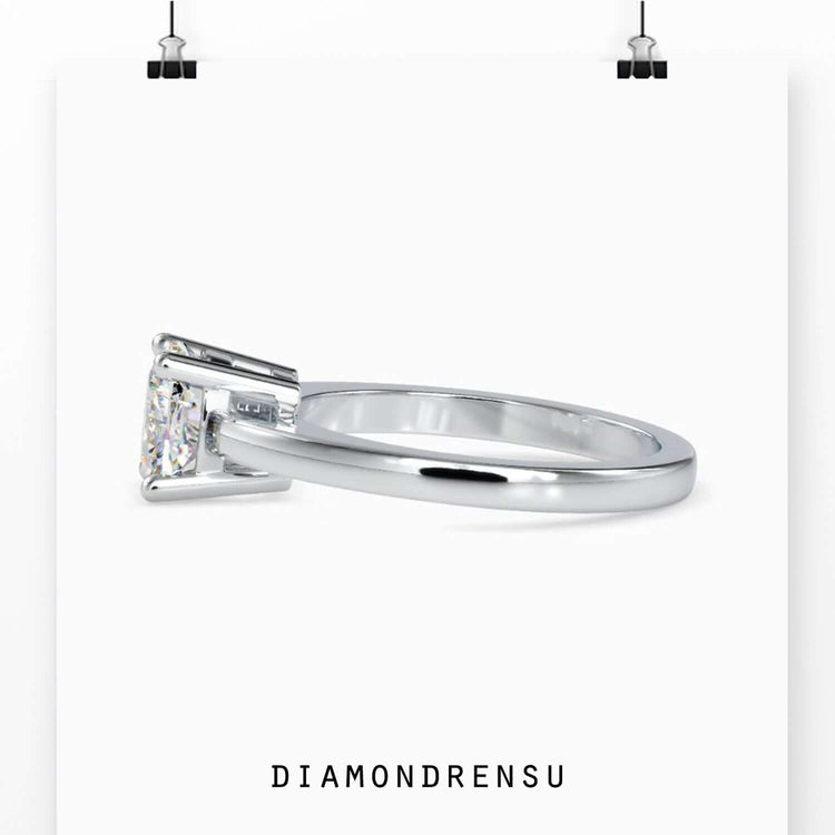 Cushion diamond solitaire ring handmade in rose gold, perfect for a custom engagement ring.
