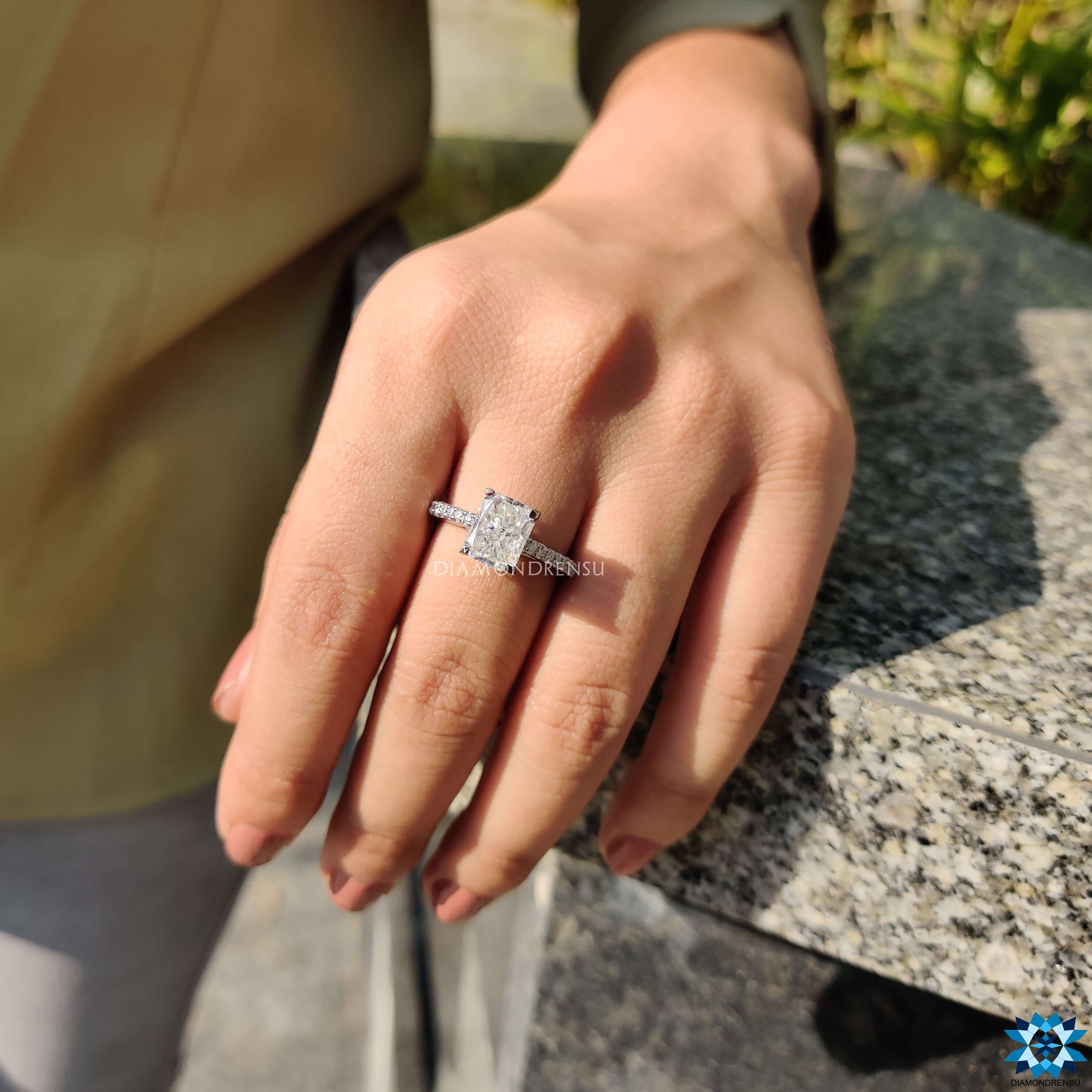 Handmade ring with radiant cut centre stone and elegant white gold band.