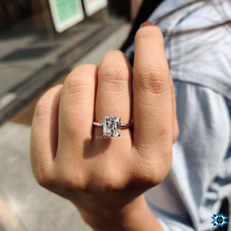 Hidden halo ring with vintage-inspired moissanite cut.
