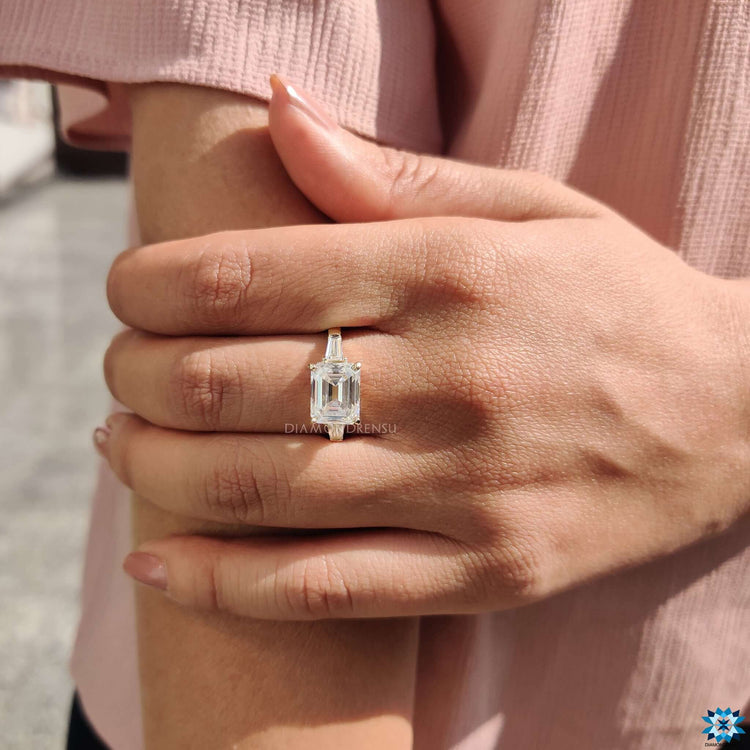 Moissanite ring with baguette accents.

