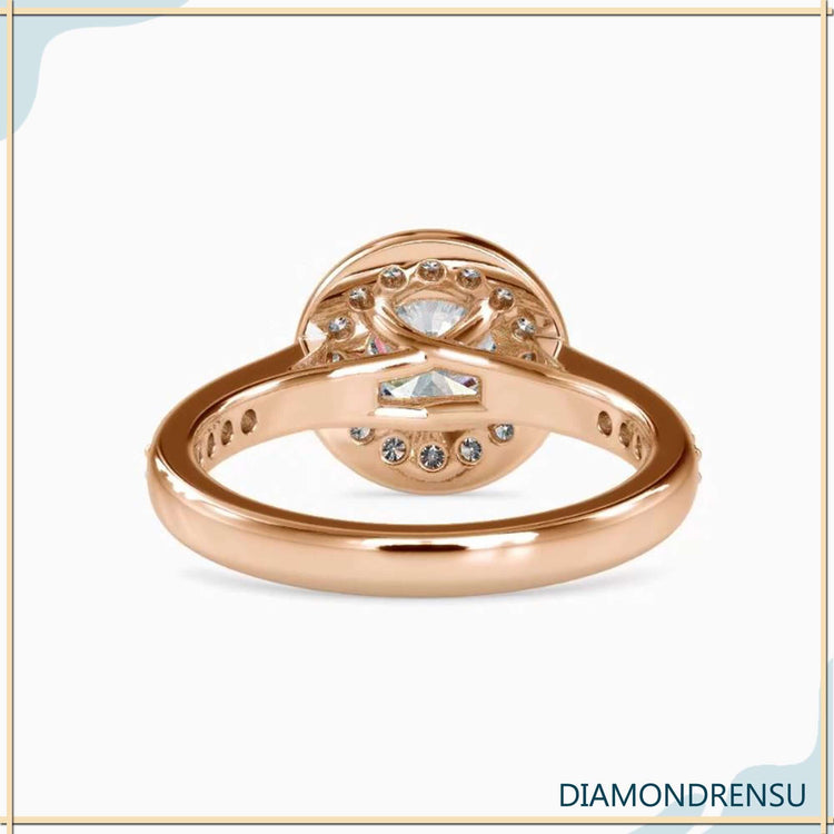 White gold engagement ring with round cut centre and pave accents.
