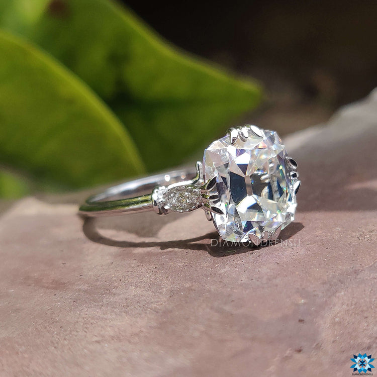 Custom engagement ring featuring cushion cut moissanite.
