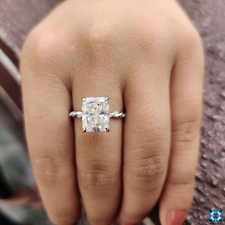 Radiant cut moissanite ring in white gold.
