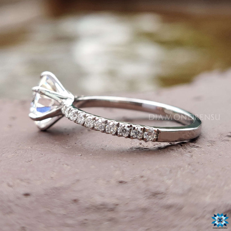 Handmade octagon cut engagement ring with pave diamonds.
