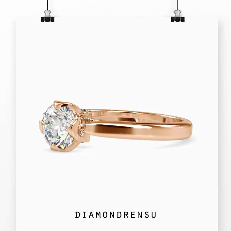 Handmade jewellery ring featuring solitaire diamond and sleek band.
