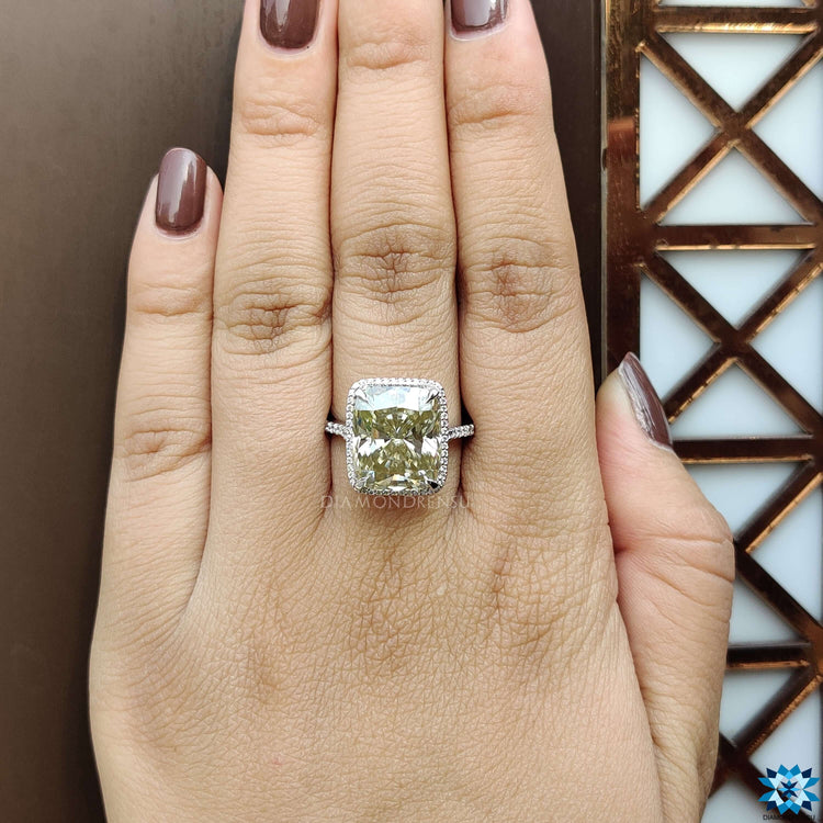 Moissanite ring with pave cut band and halo cushion stone.

