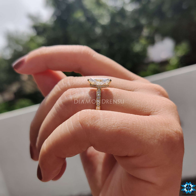 Marquise engagement ring in hidden halo and prong setting.
