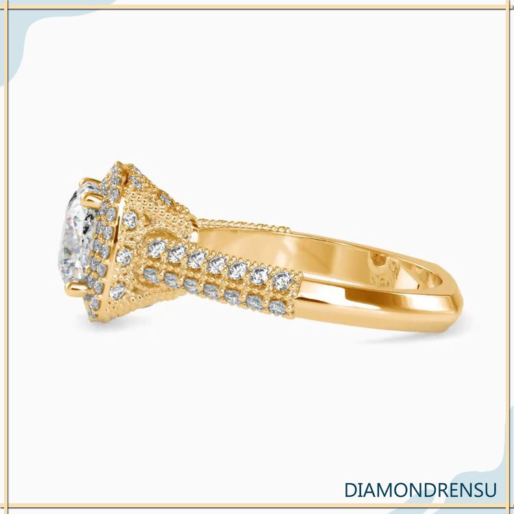 Milgrain setting ring with round cut and halo design.
