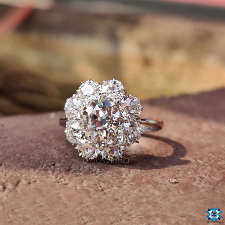 White gold moissanite ring featuring round cut center.
