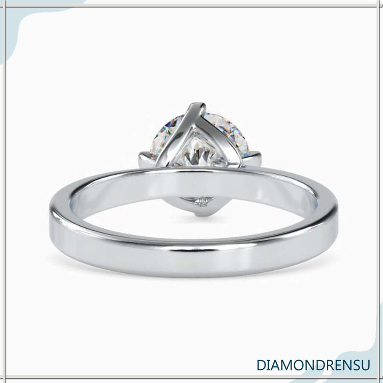 Yellow gold ring with simple diamond in solitaire setting.
