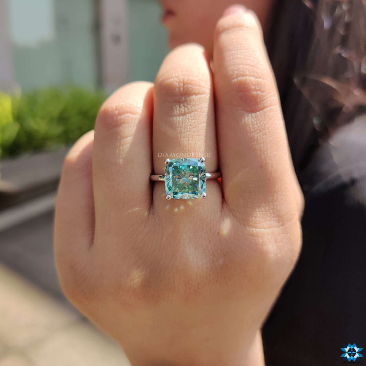 Moissanite engagement ring with colorful center stone.

