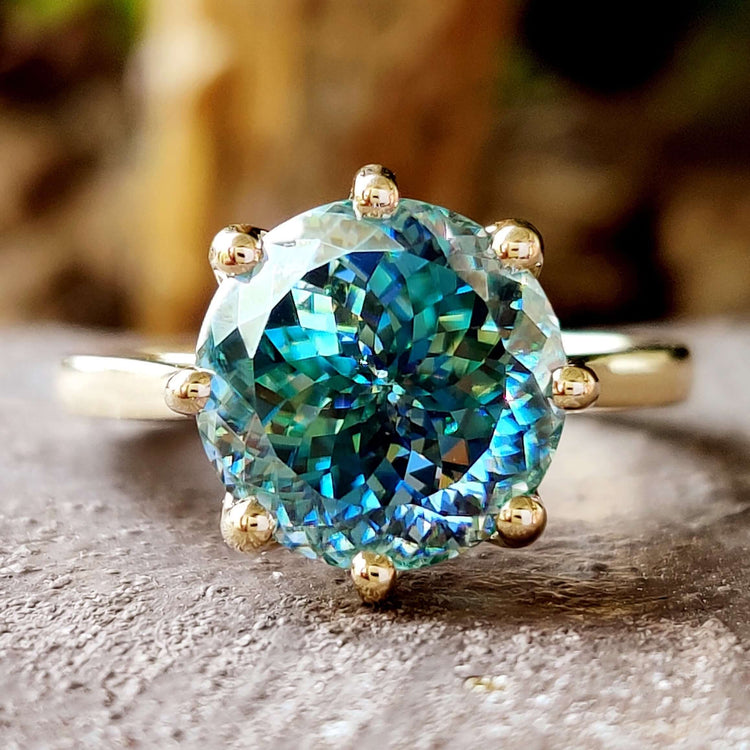 Portuguese cut moissanite ring with solitaire design.
