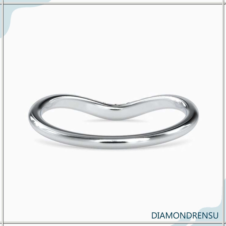 Gold wedding band featuring a 7 stone layout.
