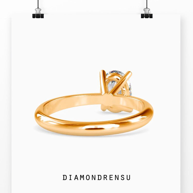 Custom design oval solitaire engagement ring UK.
